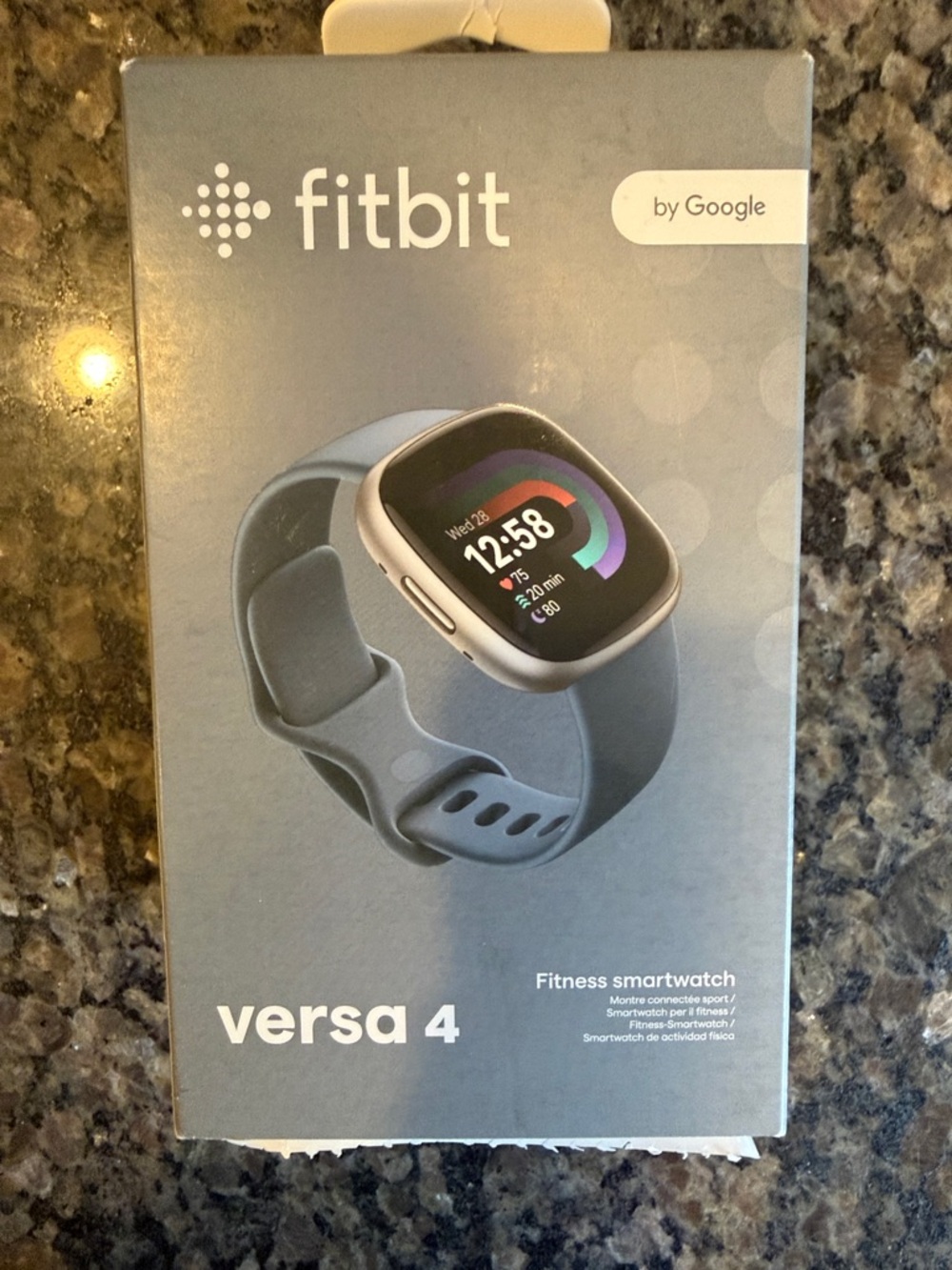 fitbit Versa 4 Silver Case with Gray Band